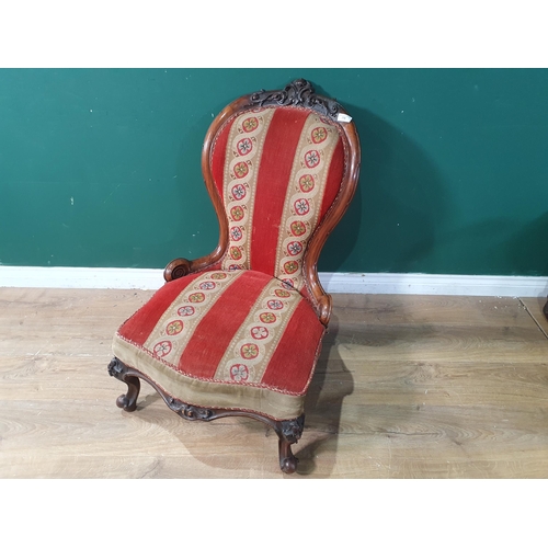 775 - A Victorian carved walnut and upholstered Nursing Chair, (R9)