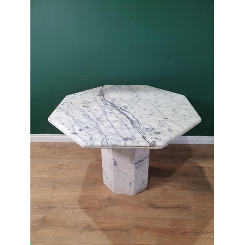 777 - An octagonal marble Centre Table on octagonal column, 3ft 3in W x 2ft 4in H, (R9