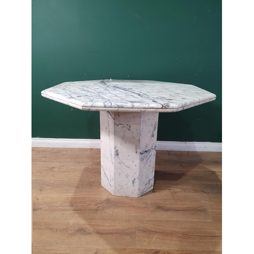 777 - An octagonal marble Centre Table on octagonal column, 3ft 3in W x 2ft 4in H, (R9