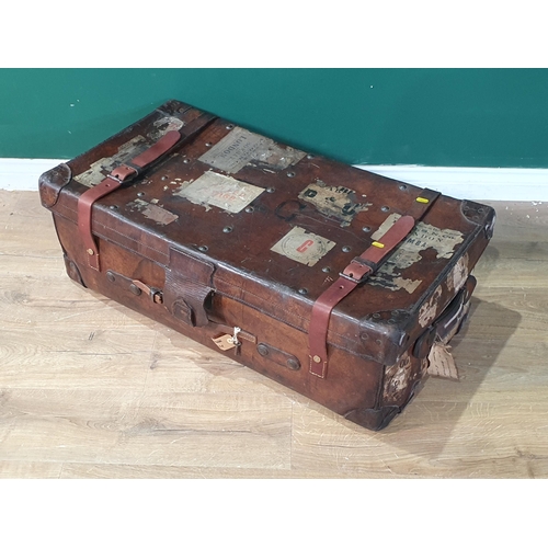 779 - A large leather Travelling Trunk with leather straps and various old stickers, 3ft W, (R9)