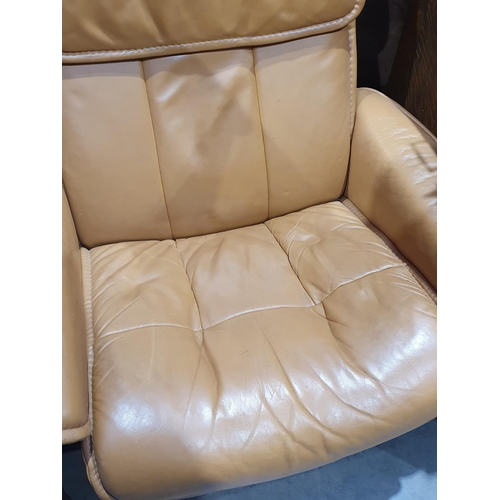 2 - A beige upholstered Armchair and matching Footstool. (R7).