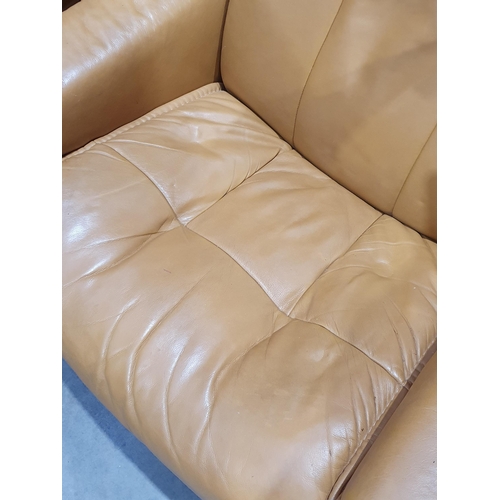 2 - A beige upholstered Armchair and matching Footstool. (R7).