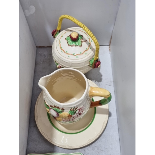 470 - A Clarice Cliff Newport Pottery Soup Bowl, a Wilkinson Ltd floral moulded Jug and a Biscuit Barrel, ... 