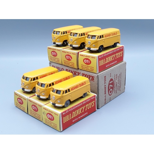 1042 - A Dublo Dinky Toys Trade Box of 6x 071 Volkswagen Delivery Vans, three with black wheels and three w... 