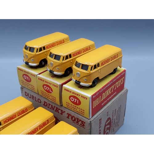 1042 - A Dublo Dinky Toys Trade Box of 6x 071 Volkswagen Delivery Vans, three with black wheels and three w... 