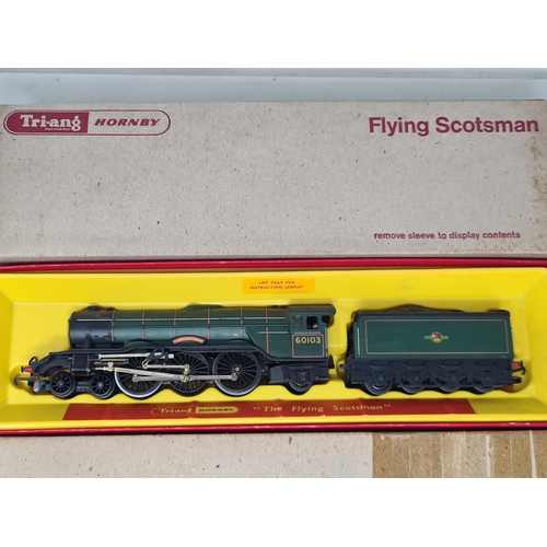 1243 - A boxed Triang Hornby 00 gauge R850 'Flying Scotsman' in BR green livery, still in card sleeve and a... 