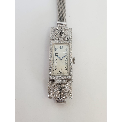 152 - An Art Deco Diamond Cocktail Watch having plain rectangular white dial with black arabic numerals in... 