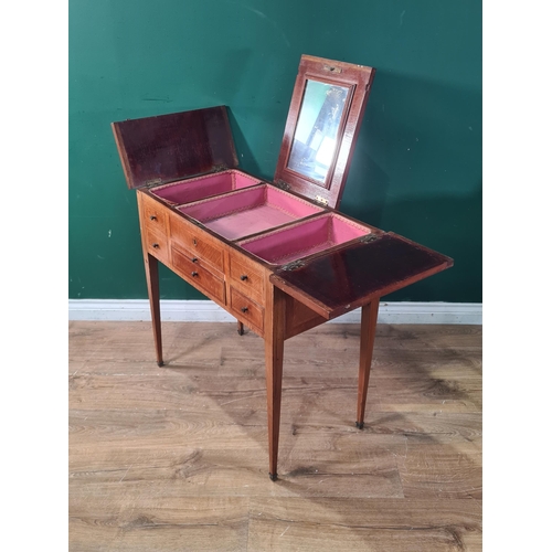 463 - A mahogany Dressing Table the top with three lift up lidded compartments one with a fitted mirror, a... 