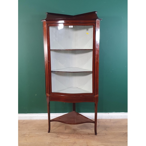 460 - An Edwardian mahogany and satinwood inlaid serpentine fronted Corner Display Cabinet, with single gl... 