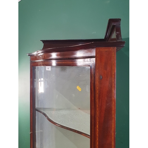 460 - An Edwardian mahogany and satinwood inlaid serpentine fronted Corner Display Cabinet, with single gl... 