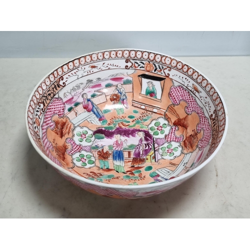 254 - A New Hall ceramic Bowl with all over famille rose pattern, figures within a landscape double border... 