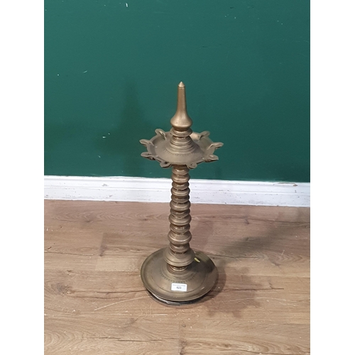 575 - An antique brass Pricket Stand with bobbin style column and circular dished base, 2ft 3