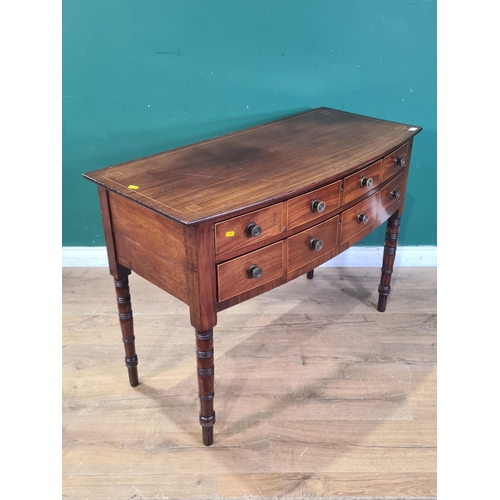 493 - An unusual Regency mahogany bow front Side Table with satinwood stringing, fitted two long drawers a... 