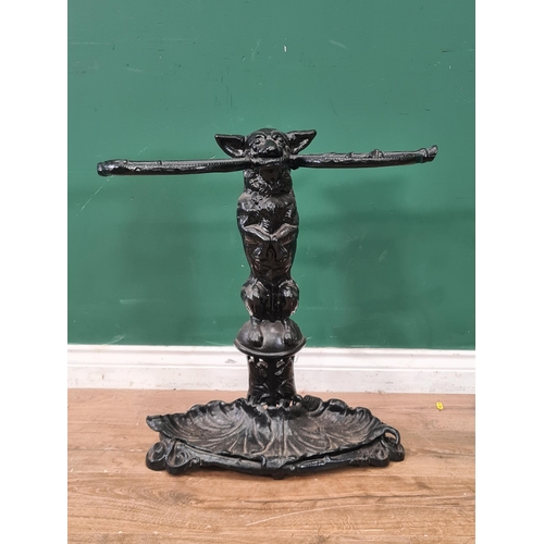 349 - A cast iron Stick Stand in the form of a seated dog with a whip in it's mouth 2ft H x 1ft 11in W  (A... 