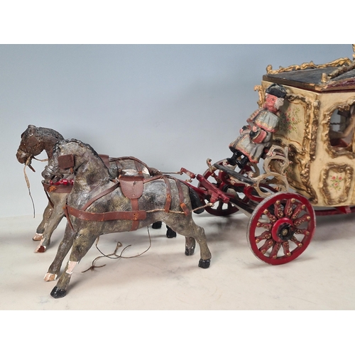 10 - A painted Horse drawn Carriage in wood and plaster, with driver and passenger, A/F, approx 2ft 7