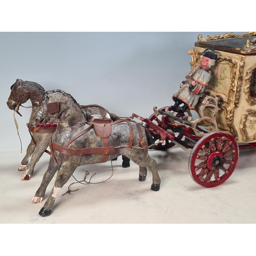 10 - A painted Horse drawn Carriage in wood and plaster, with driver and passenger, A/F, approx 2ft 7