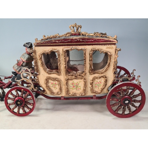 10 - A painted Horse drawn Carriage in wood and plaster, with driver and passenger, A/F, approx 2ft 7