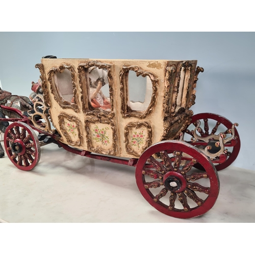 10 - A painted Horse drawn Carriage in wood and plaster, with driver and passenger, A/F, approx 2ft 7