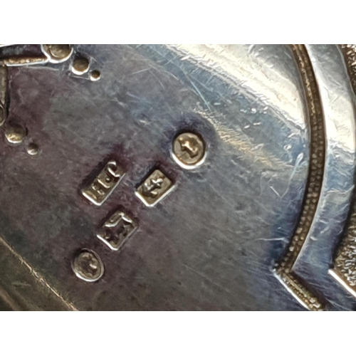 118 - A Victorian silver Jug with floral embossing and vacant cartouche, Birmingham 1883