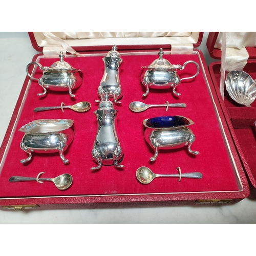 126 - A plated six piece Condiment Set, and a Set of plated Spoons, both cased