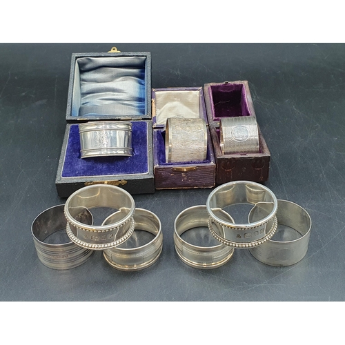 131 - Nine various silver Napkin Rings, 270gms, three with boxes