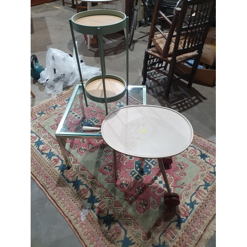 149 - A two tier Occasional Table, an oval Dinner Tray on castors, and a square glass topped Coffee Table.... 