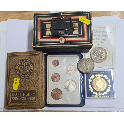 157 - A small tin Money Box, containing various British and World Coins, to include modern commemorative C... 