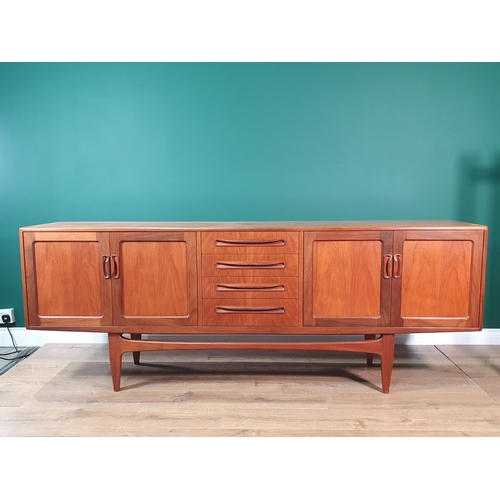 178 - A G-plan mid-Century extending Dining Table, four Chairs and a Sideboard, the Sideboard fitted four ... 