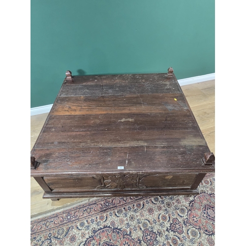 186 - A large oak Coffee Table with carved panels and doors to the sides, 3ft 10in x 3ft 11in x 1ft 7in H,... 