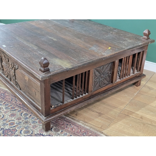 186 - A large oak Coffee Table with carved panels and doors to the sides, 3ft 10in x 3ft 11in x 1ft 7in H,... 