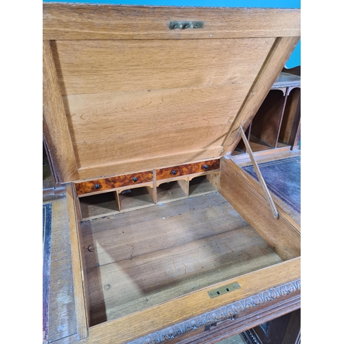 187 - A Victorian carved oak Pedestal Desk, the raised top fitted letter compartment and pigeonholes with ... 