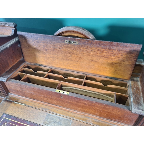 187 - A Victorian carved oak Pedestal Desk, the raised top fitted letter compartment and pigeonholes with ... 