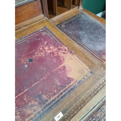 187 - A Victorian carved oak Pedestal Desk, the raised top fitted letter compartment and pigeonholes with ... 