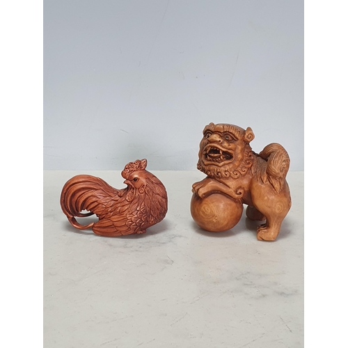 2 - Two carved wood Netsuke in the form of a Dog of Fo and a Cockerel. (Cab).