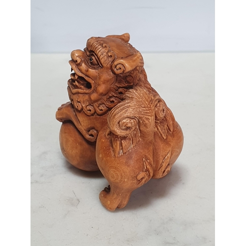 2 - Two carved wood Netsuke in the form of a Dog of Fo and a Cockerel. (Cab).