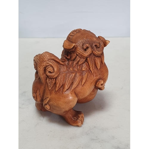 2 - Two carved wood Netsuke in the form of a Dog of Fo and a Cockerel. (Cab).