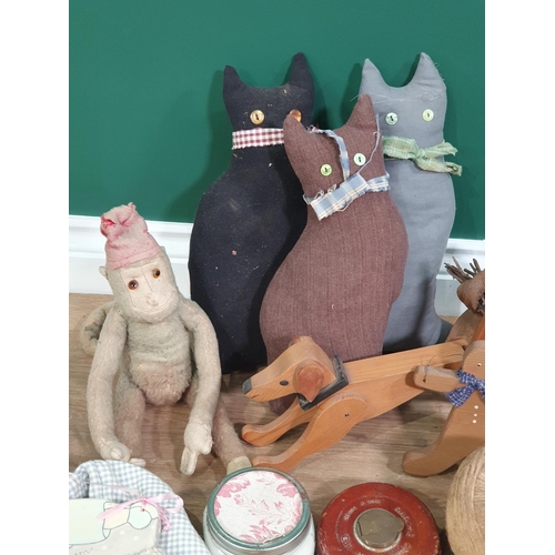 234 - Three soft Toy Cats, a vintage soft toy Monkey, a wooden Ginger Breadman, Dog, three faux Plants in ... 