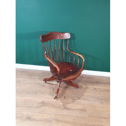 235 - An oak and leather upholstered swivel Desk Chair, (R6)