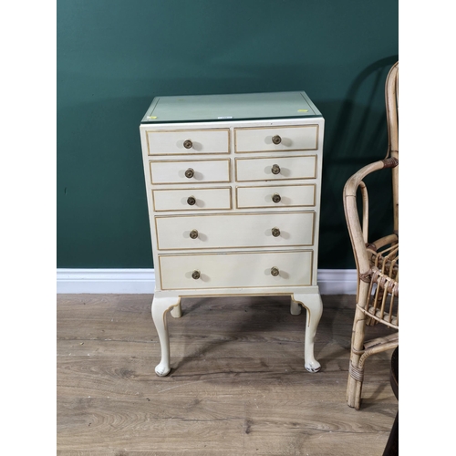 240 - A small white painted Chest of eight drawers on cabriole supports, 18in W x 2ft 6in H, with glass to... 