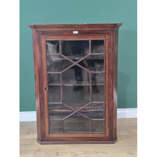 248 - A 19th Century walnut hanging Corner Cupboard with single astragal glazed door enclosing shaped shel... 