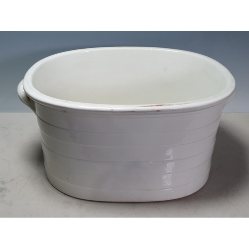 25 - A Wedgewood white ceramic twin handled banded Footbath, 8