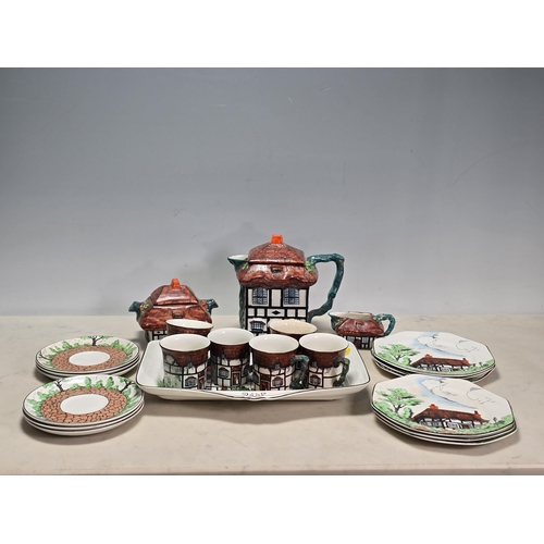 251 - A John Haddock & Sons Ltd 'Rustic' Coffee Set with cottage design, including coffee pot, sucrier, cr... 