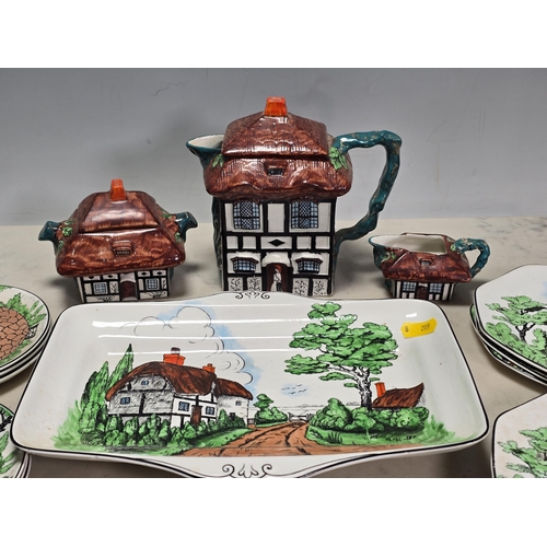 251 - A John Haddock & Sons Ltd 'Rustic' Coffee Set with cottage design, including coffee pot, sucrier, cr... 