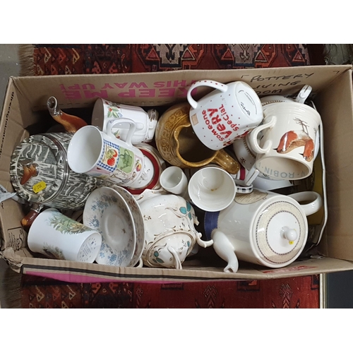 258 - Four boxes containing various ceramic items including teapots, jug, plates, mugs, etc, a box of foot... 