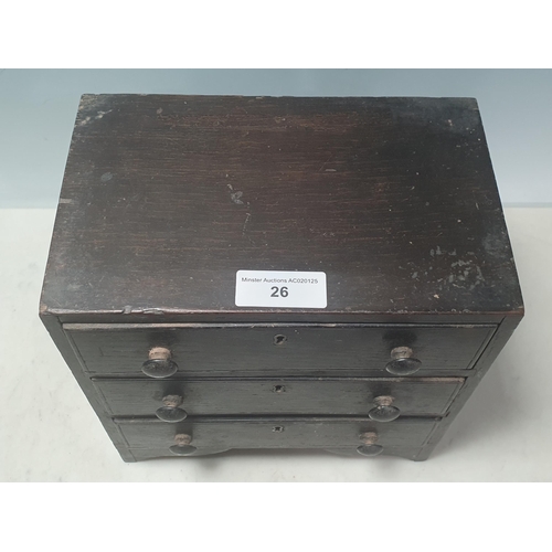 26 - An antique oak Apprentice Chest of three drawers on bracket feet 9 1/2in W x 9 1/2in H (R3)