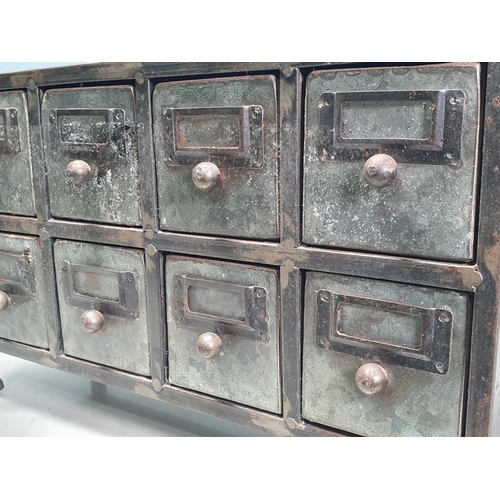 28 - A metal Bank of drawers 1ft 3in W x 9in H (R3)