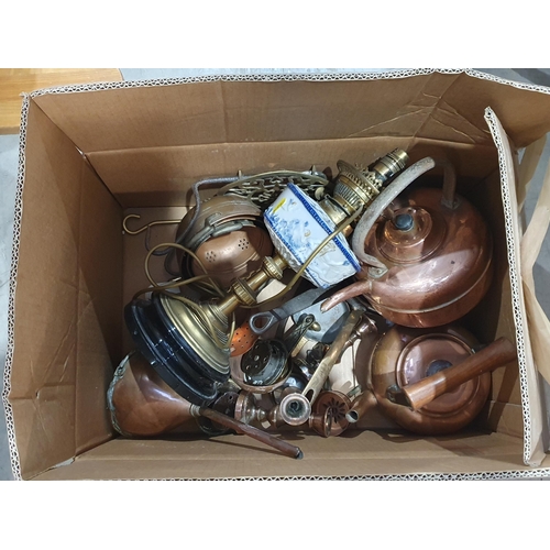 334 - A box containing a brass and ceramic Paraffin Lamp, copper Kettles, Pans, copper Draining Bowls, Fun... 