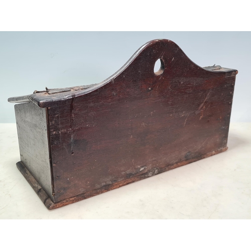 34 - An antique oak Candle Box with hinged cover and containing candles, 14 1/2in W, (R6)