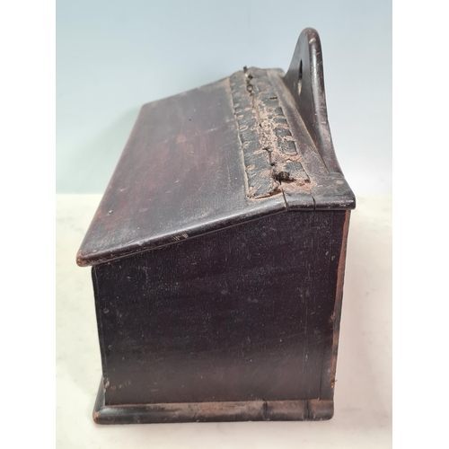 34 - An antique oak Candle Box with hinged cover and containing candles, 14 1/2in W, (R6)