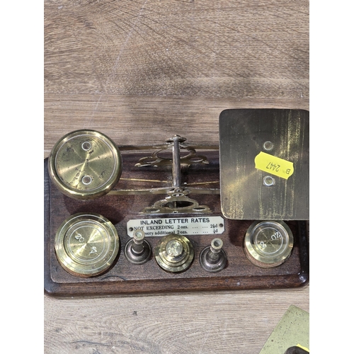 345 - A set of brass and mahogany Postal Scales, a pair of brass Wall Lights, four pairs of Binoculars and... 